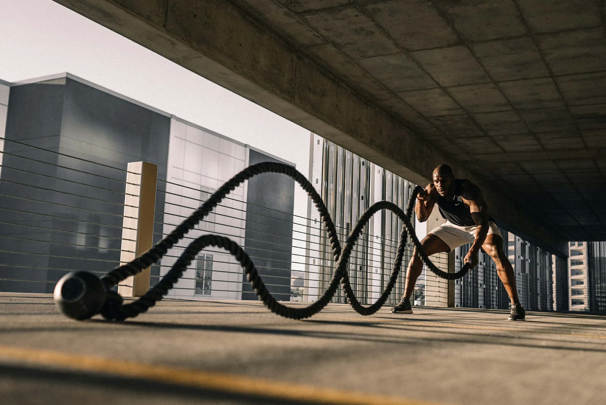 Athlete training with battle ropes