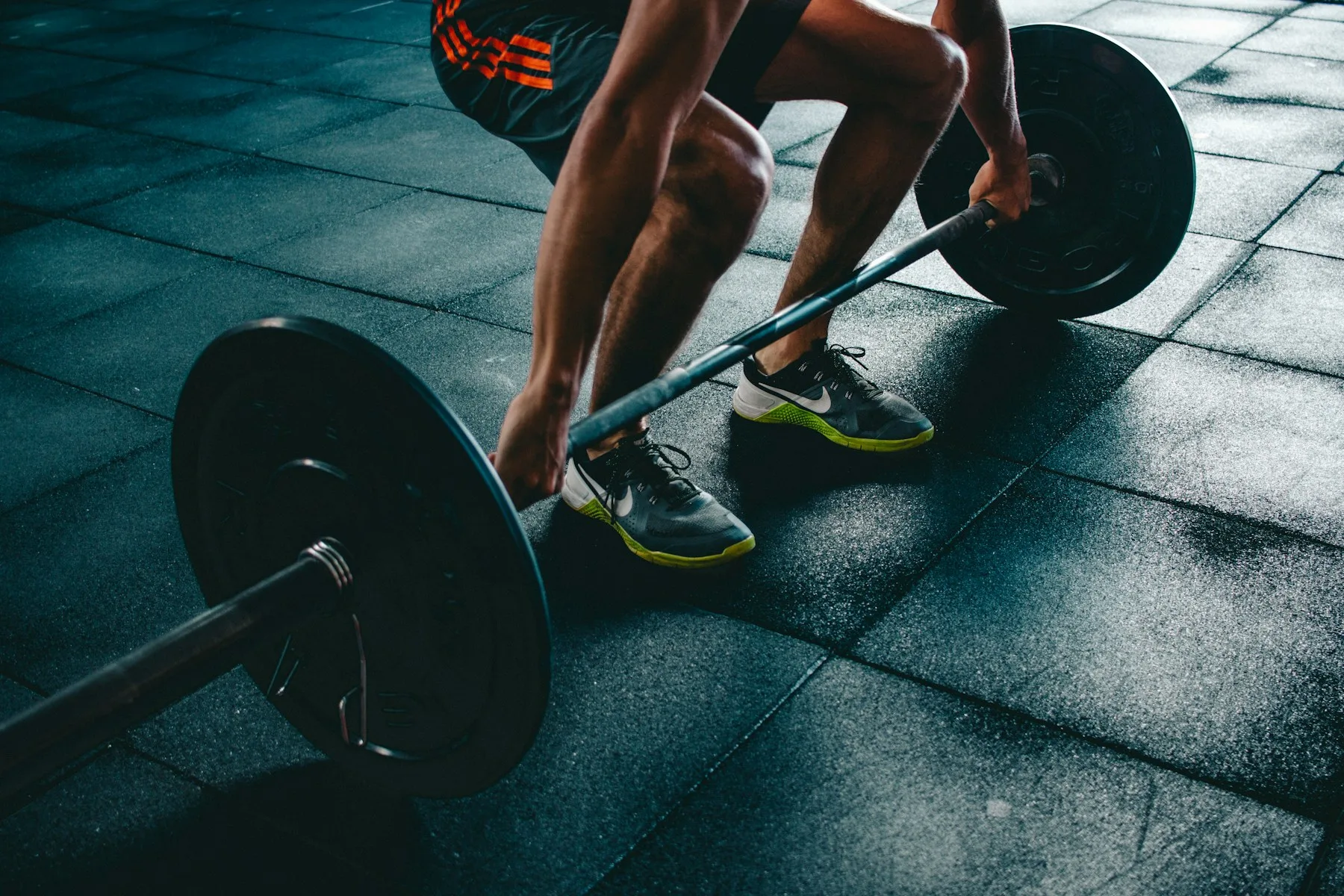 Athlete preparing to deadlift a barbell